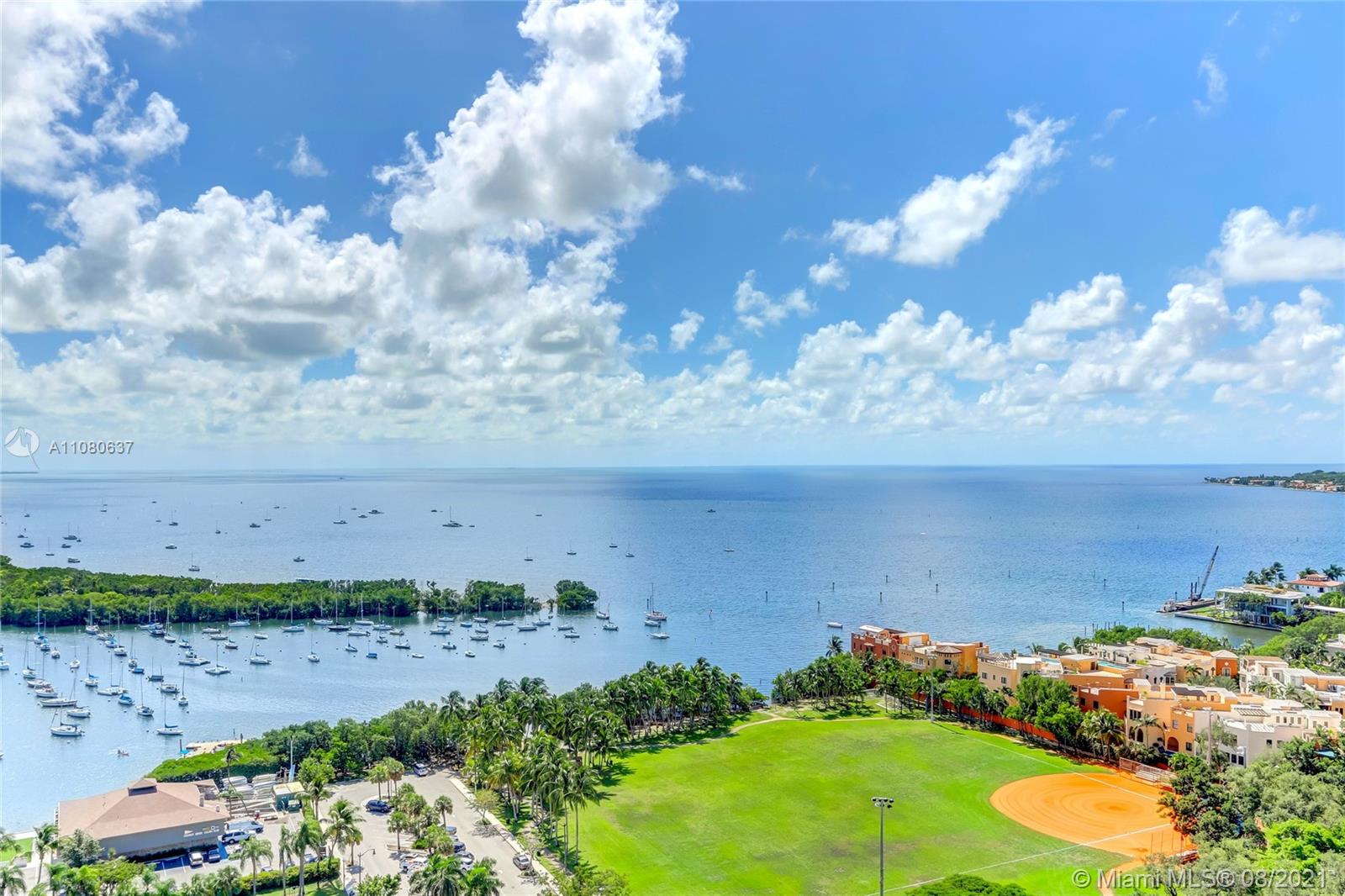 2889 McFarlane Road, Unit 2114 Coconut Grove, FL 33133 - Photo 8 of 15 a view of a bunch of flowers in front of statue