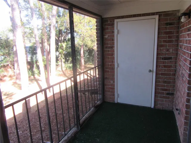 a view of a swimming pool with an outdoor seating