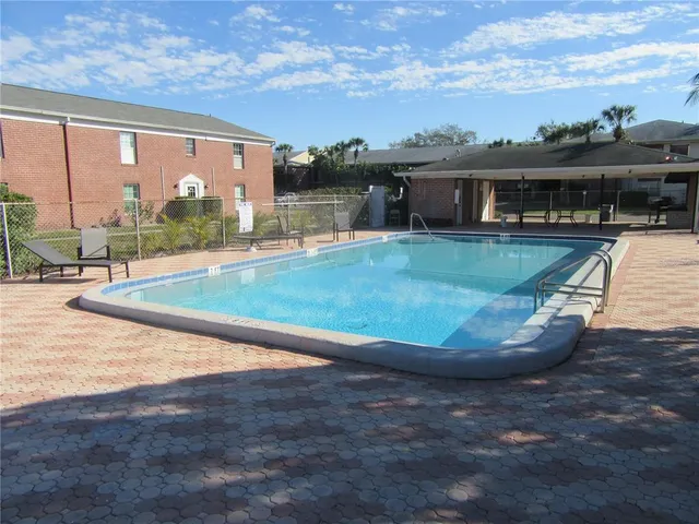 a view of swimming pool from a balcony
