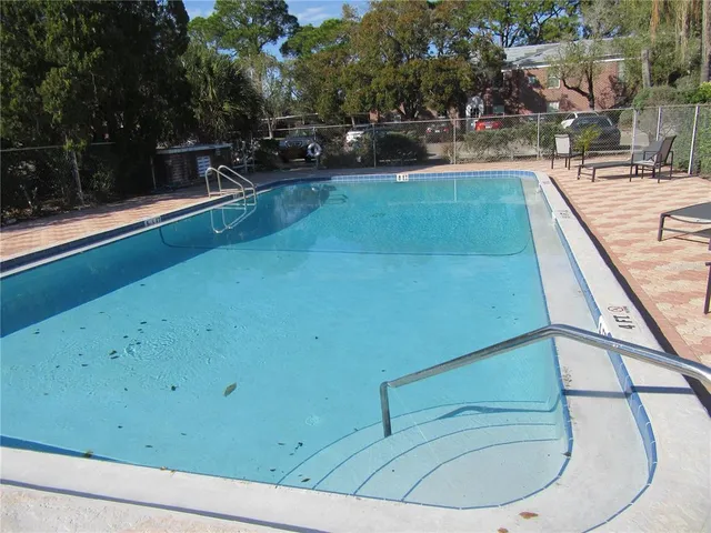a view of a room with a large window and table in it