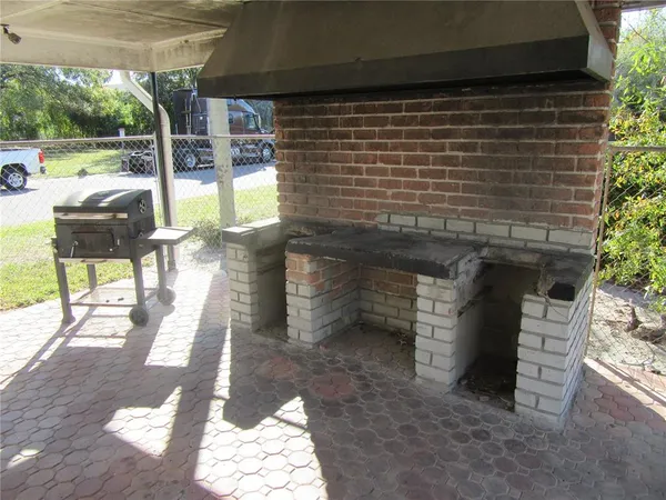 a view of a patio with a yard