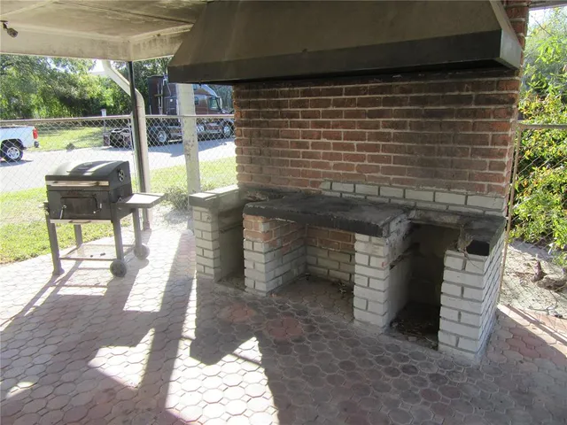 a view of a patio with a yard