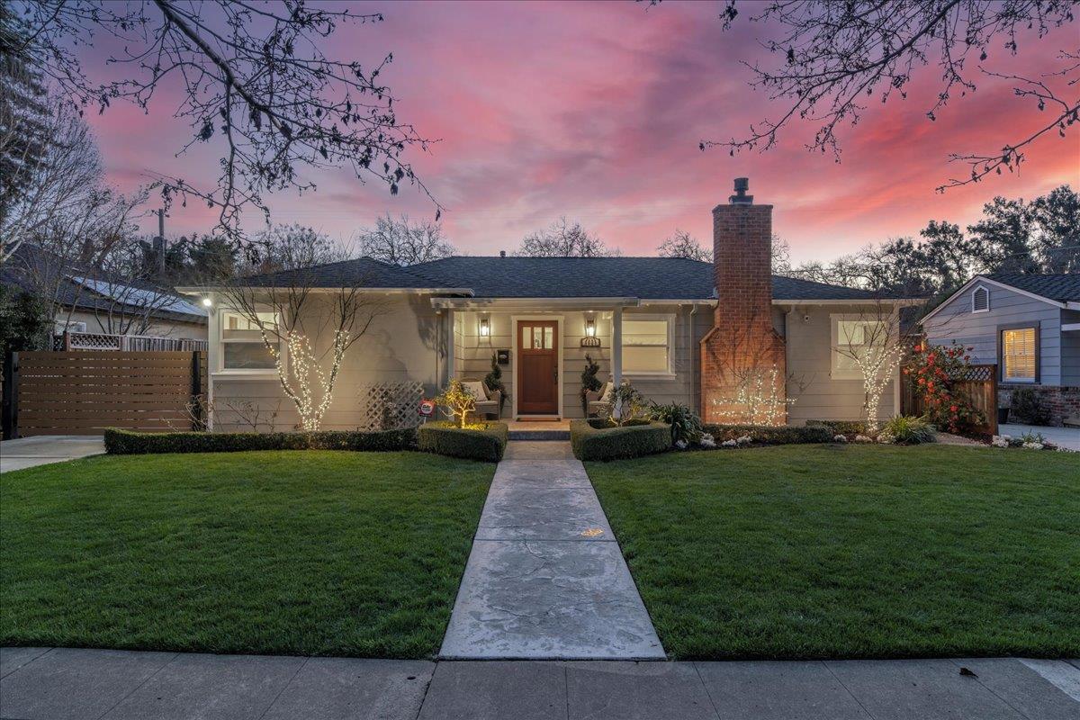a front view of a house with garden