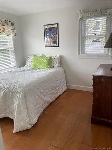 a bathroom with a toilet and a shower curtain