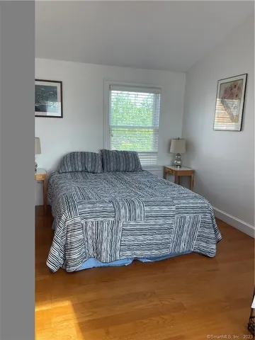 a room with a bed and a window