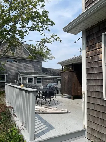 a view of a brick house with large windows