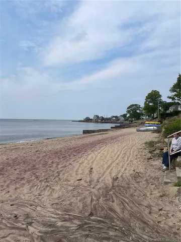 a view of an ocean beach and mountain