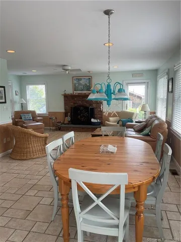 a view of a dining room with furniture window and outside view