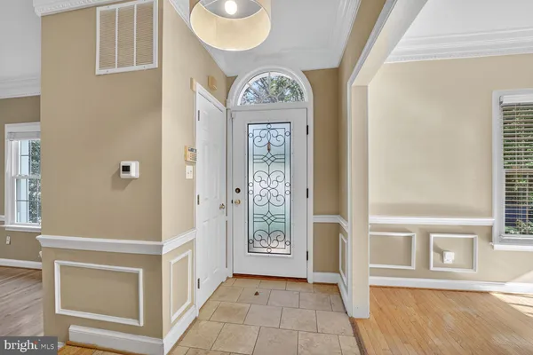 a view of an entryway with wooden floor