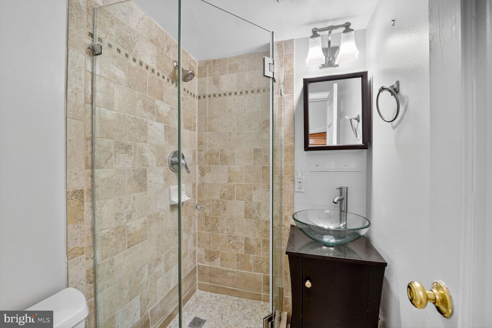 4200 River Road Northwest Washington, DC 20016 - Photo 28 of 52 a bathroom with a toilet a sink and shower