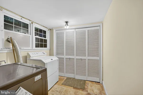 a kitchen with a sink and a window