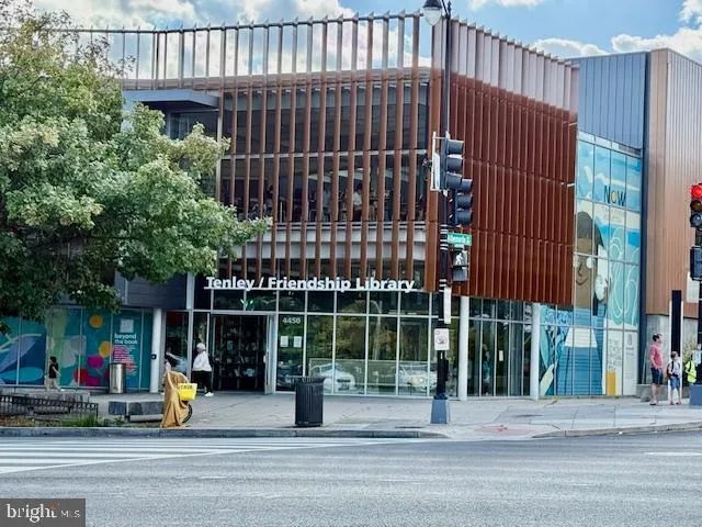 a picture of a bench in front of a window