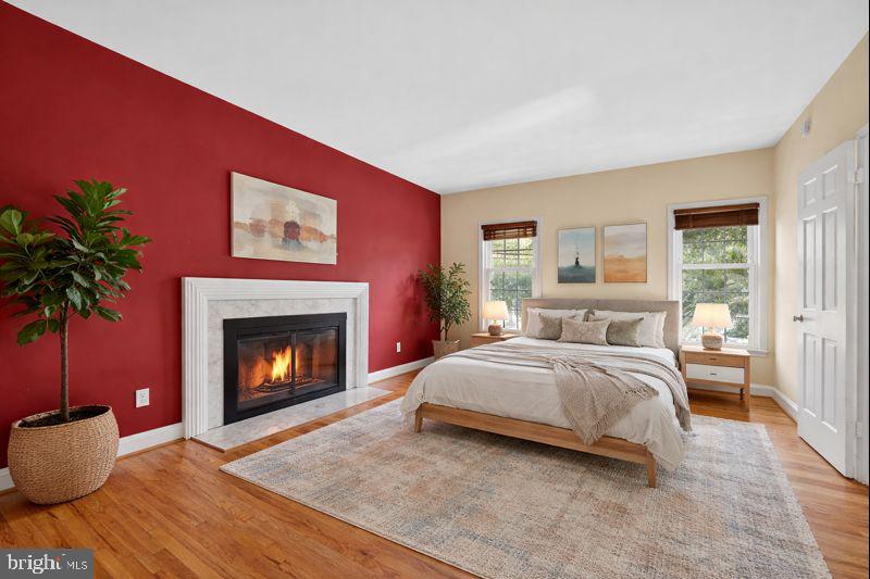 4200 River Road Northwest Washington, DC 20016 - Photo 7 of 52 a spacious bedroom with a bed and a fireplace