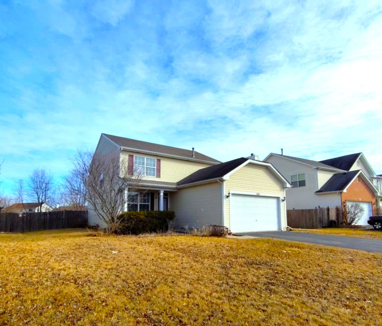 1404 Roth Drive Joliet, IL 60431 - Photo 1 of 52 a front view of a house with a yard