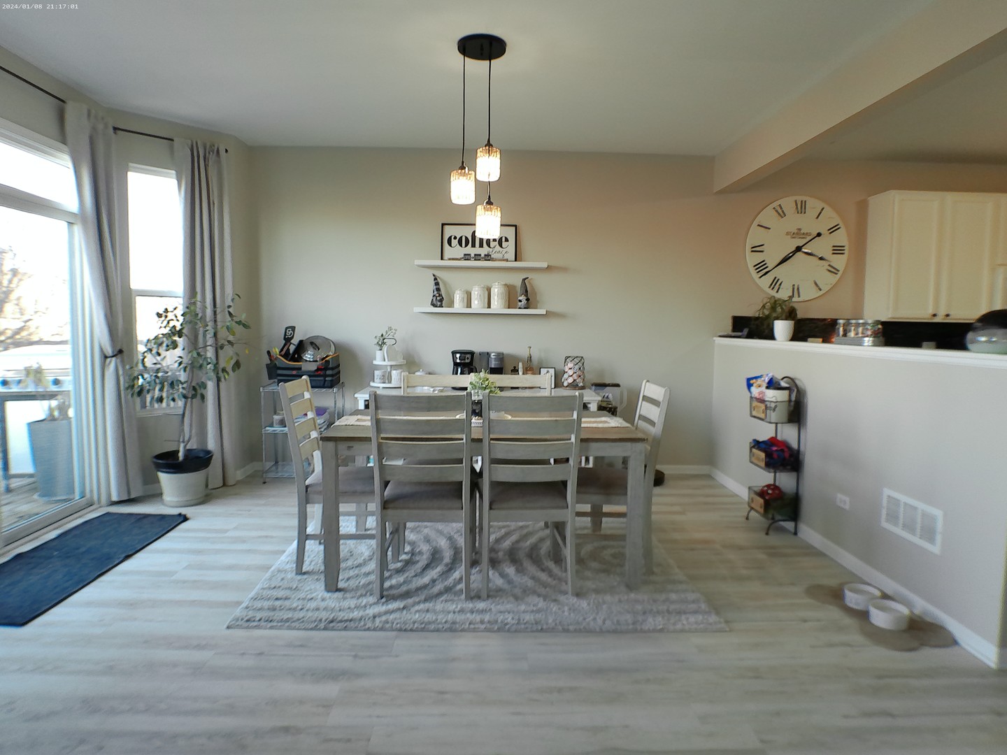 1404 Roth Drive Joliet, IL 60431 - Photo 11 of 52 a dining room with wooden floor a chandelier a wooden table and chairs