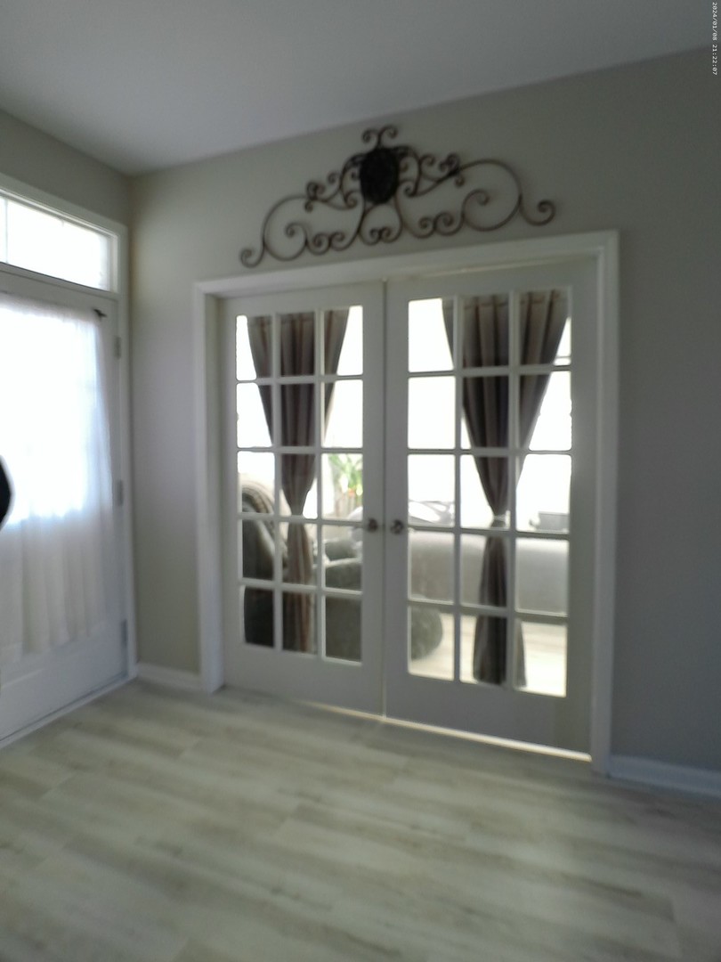 1404 Roth Drive Joliet, IL 60431 - Photo 19 of 52 a view of wooden floor in a room