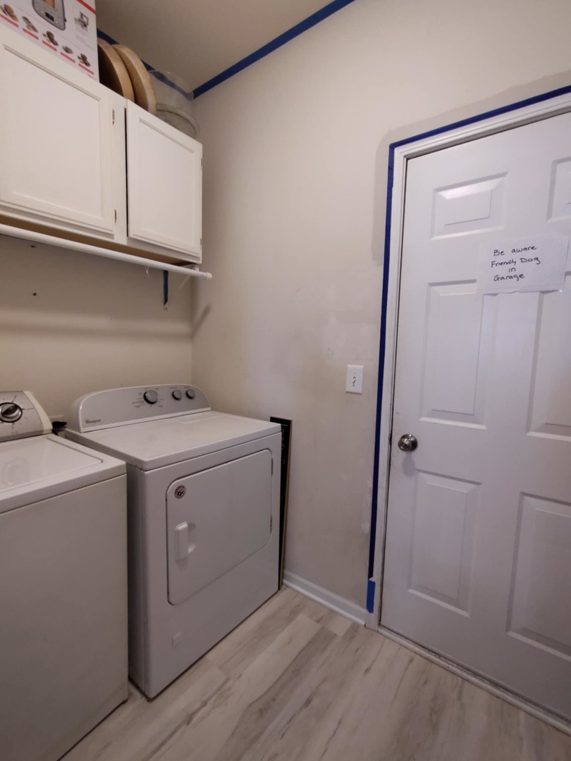 1404 Roth Drive Joliet, IL 60431 - Photo 24 of 52 a utility room with cabinets washer and dryer