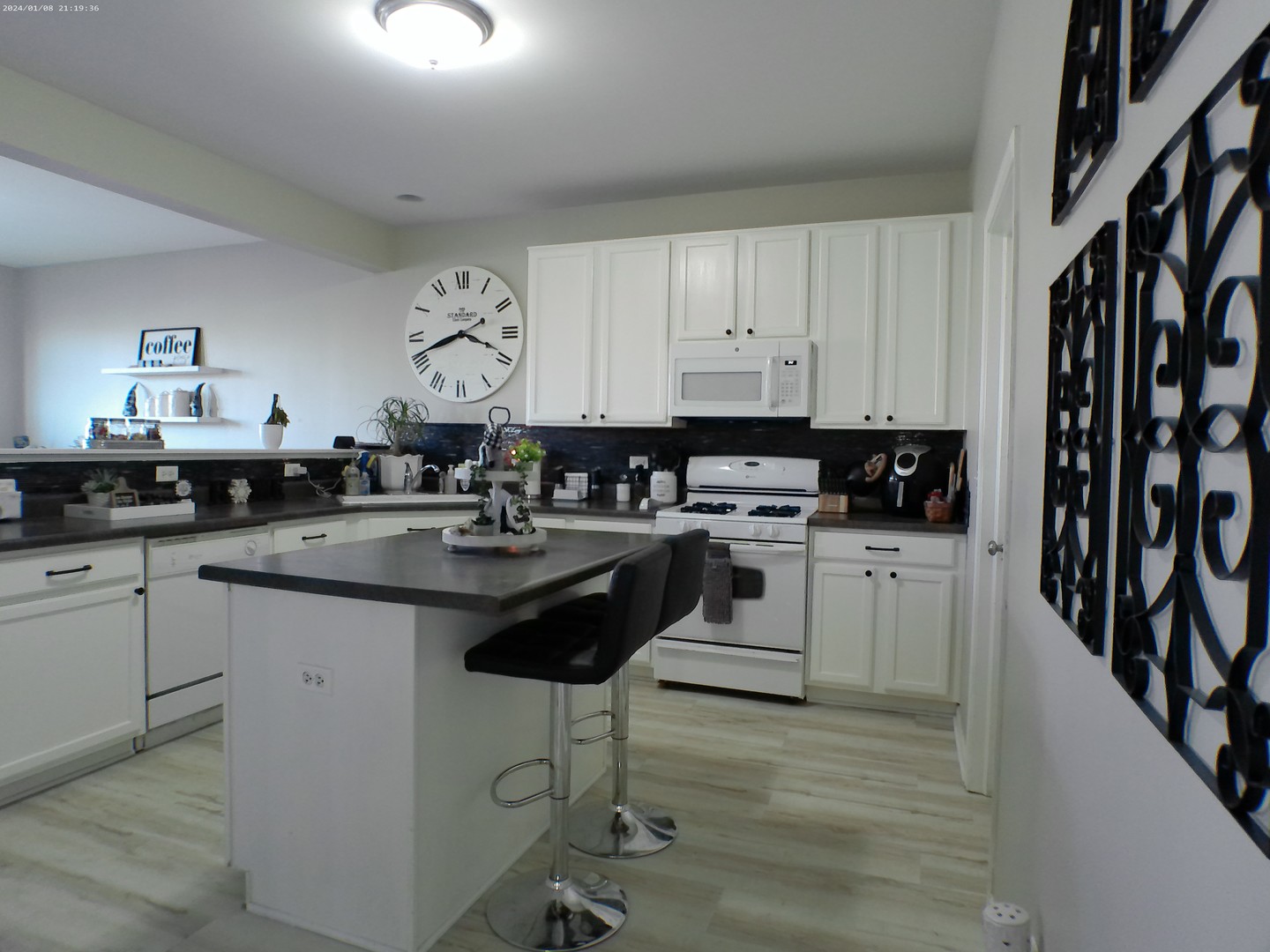 1404 Roth Drive Joliet, IL 60431 - Photo 3 of 52 a kitchen with granite countertop a sink a stove cabinets and a dining table
