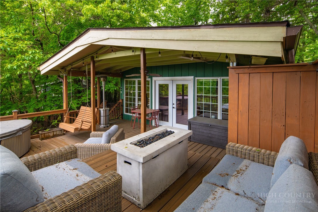 280 Chinkapin Ridge Road Seven Devils, NC 28604 - Photo 20 of 40 a view of a couches in the patio