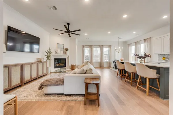a living room with fireplace furniture and a flat screen tv