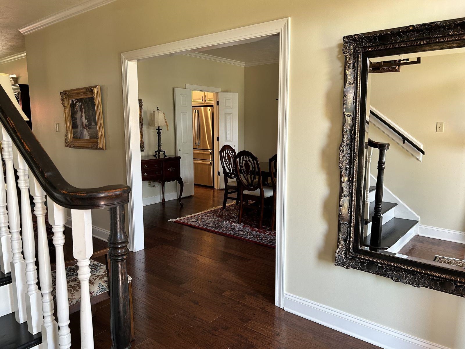 110 Eagle Trace Road Covington, TN 38019 - Photo 5 of 10 Hallway featuring ornamental molding and dark hardwood / wood-style flooring