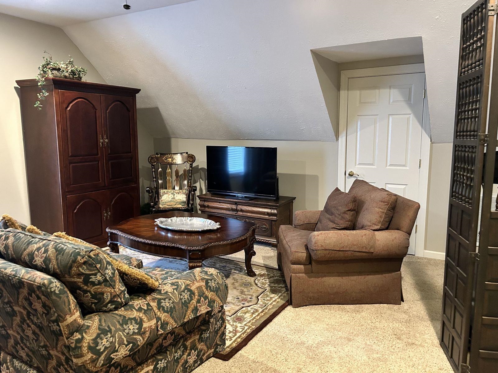110 Eagle Trace Road Covington, TN 38019 - Photo 6 of 10 Carpeted living room with vaulted ceiling