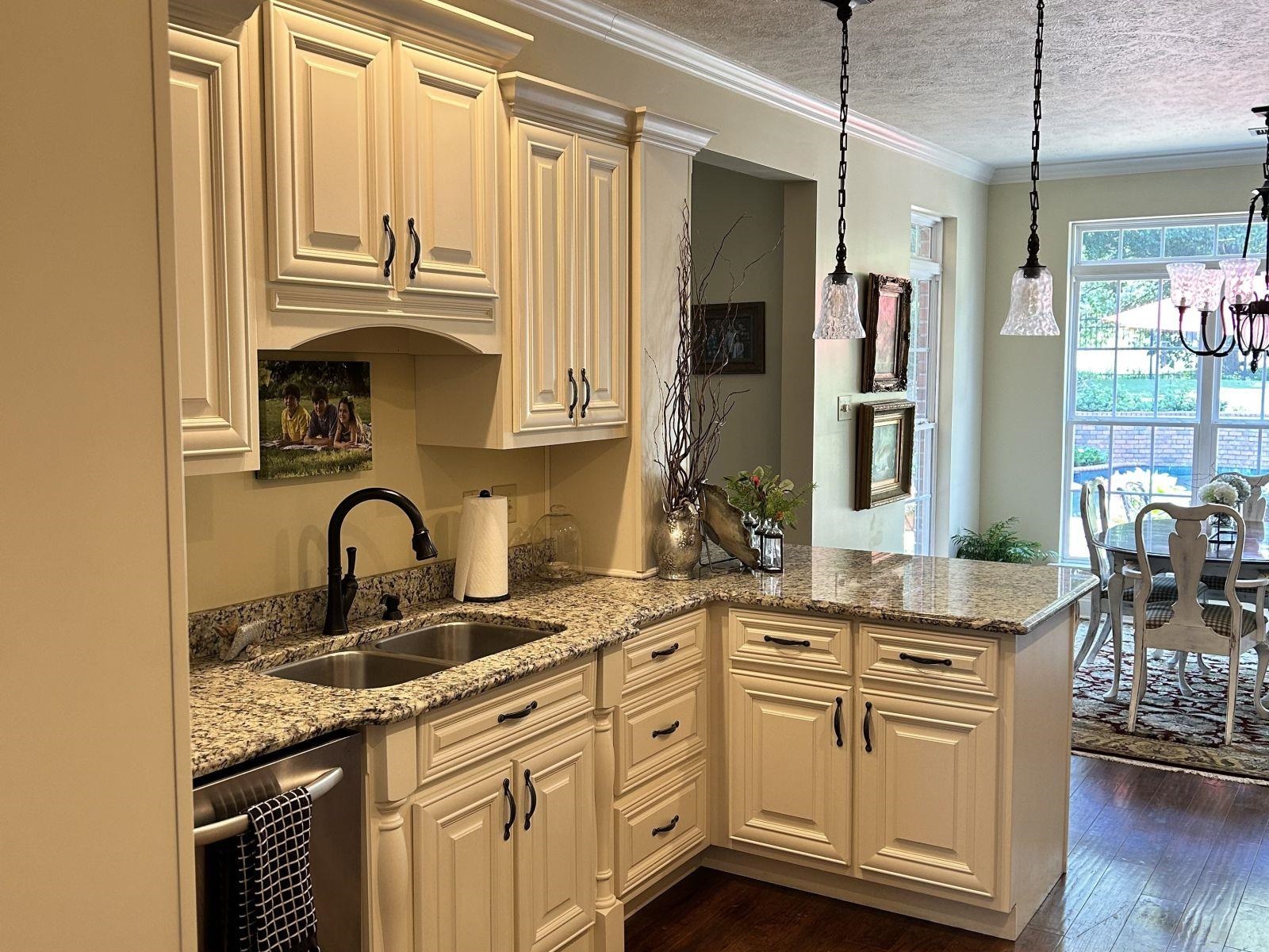 110 Eagle Trace Road Covington, TN 38019 - Photo 7 of 10 Kitchen with ornamental molding, dark hardwood / wood-style floors, pendant lighting, sink, and dishwasher