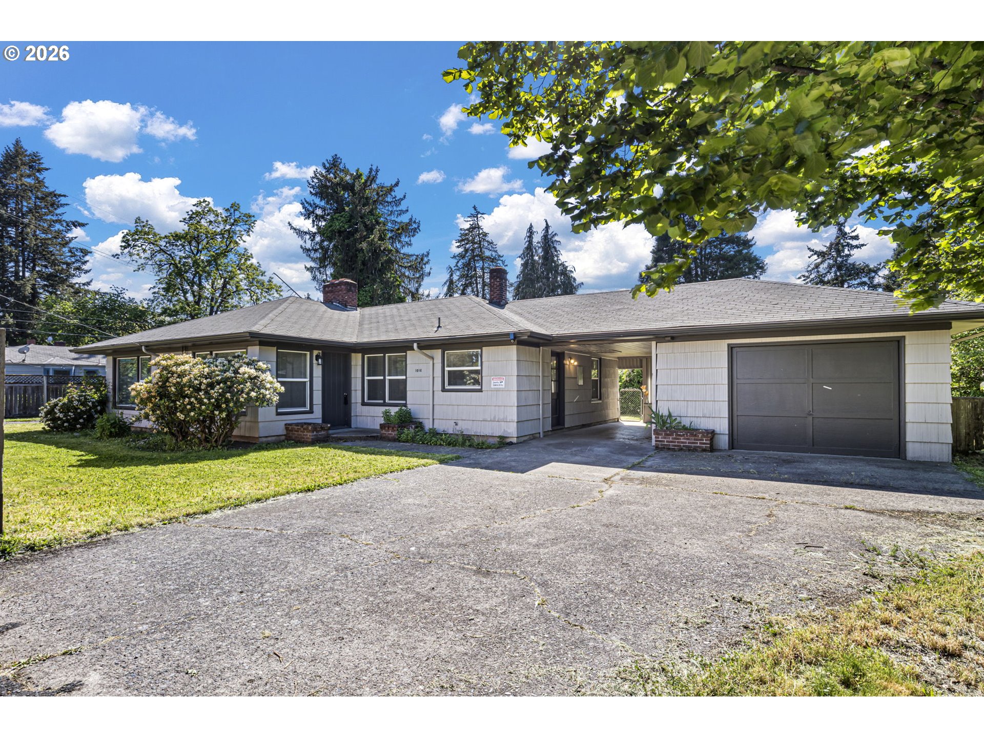 1008 Coburg Road Eugene, OR 97401 - Photo 27 of 46 a front view of a house with a yard and garage
