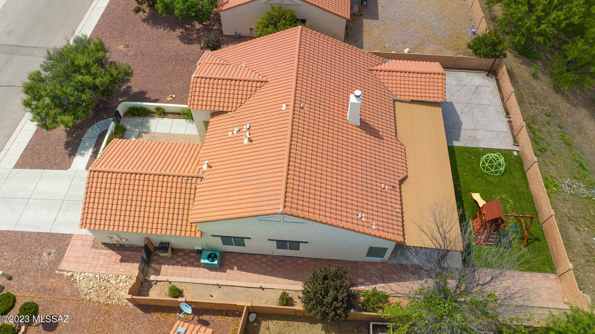401 Via Capri Rio Rico, AZ 85648 - Photo 4 of 38 a backyard of a house with outdoor seating