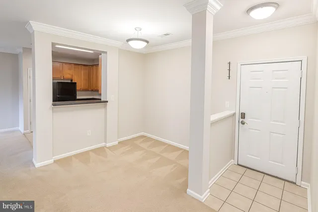 a view of kitchen with stainless steel appliances granite countertop lots of counter top space and cabinets