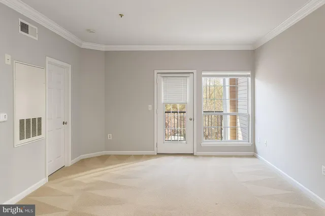 a kitchen with granite countertop a refrigerator stove and microwave