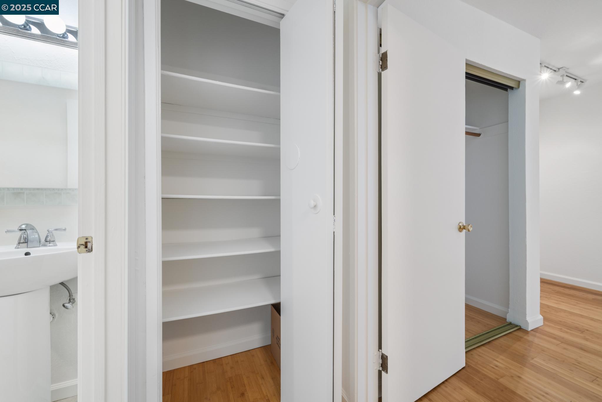 150 Pearl Street, Unit 122 Oakland, CA 94611 - Photo 17 of 34 a view of walk in closet with empty racks