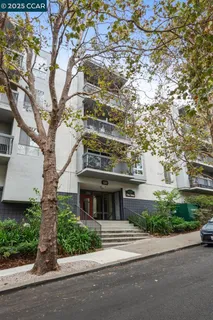 a building outdoor space with patio furniture and potted plants