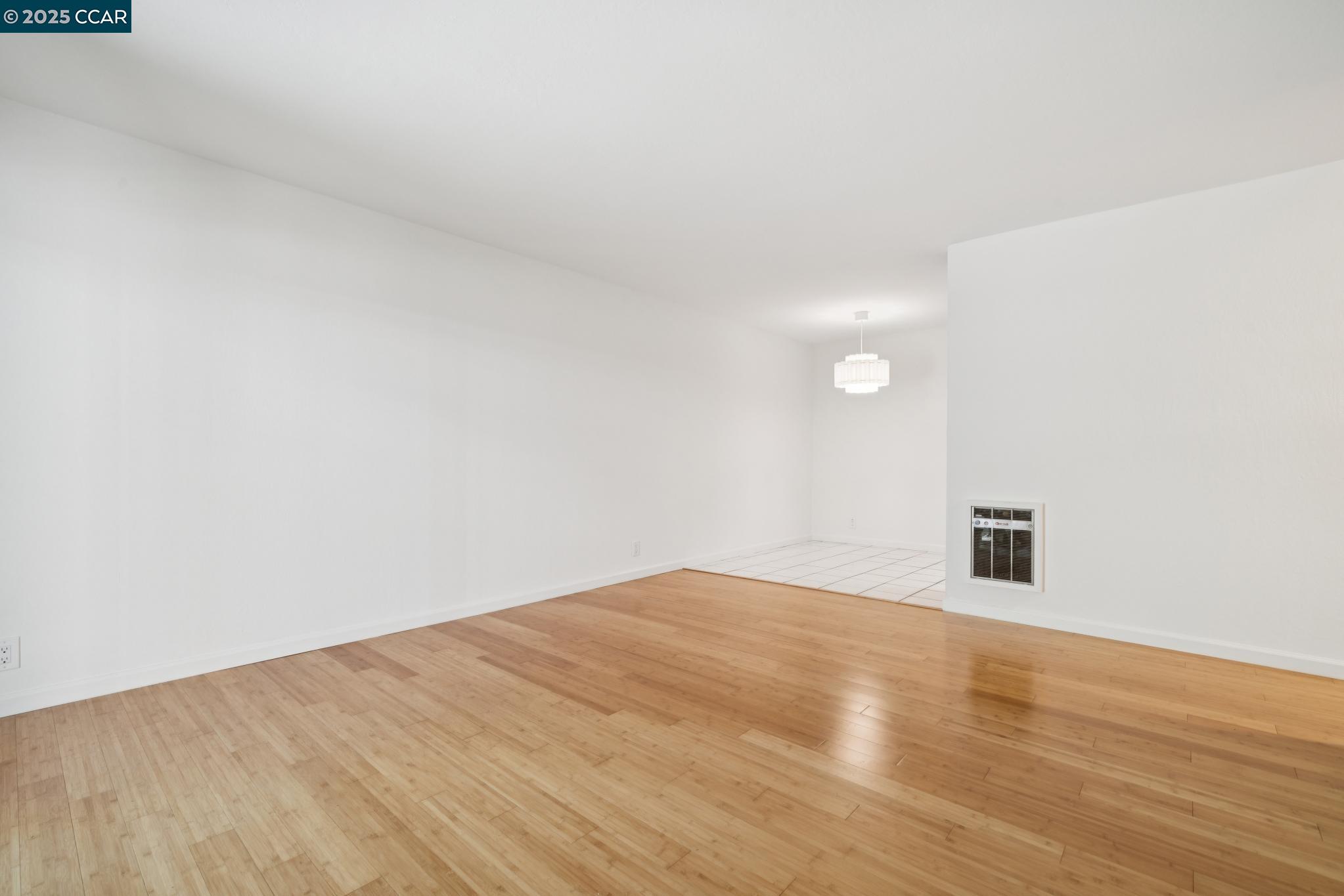 150 Pearl Street, Unit 122 Oakland, CA 94611 - Photo 6 of 34 a view of empty room with wooden floor