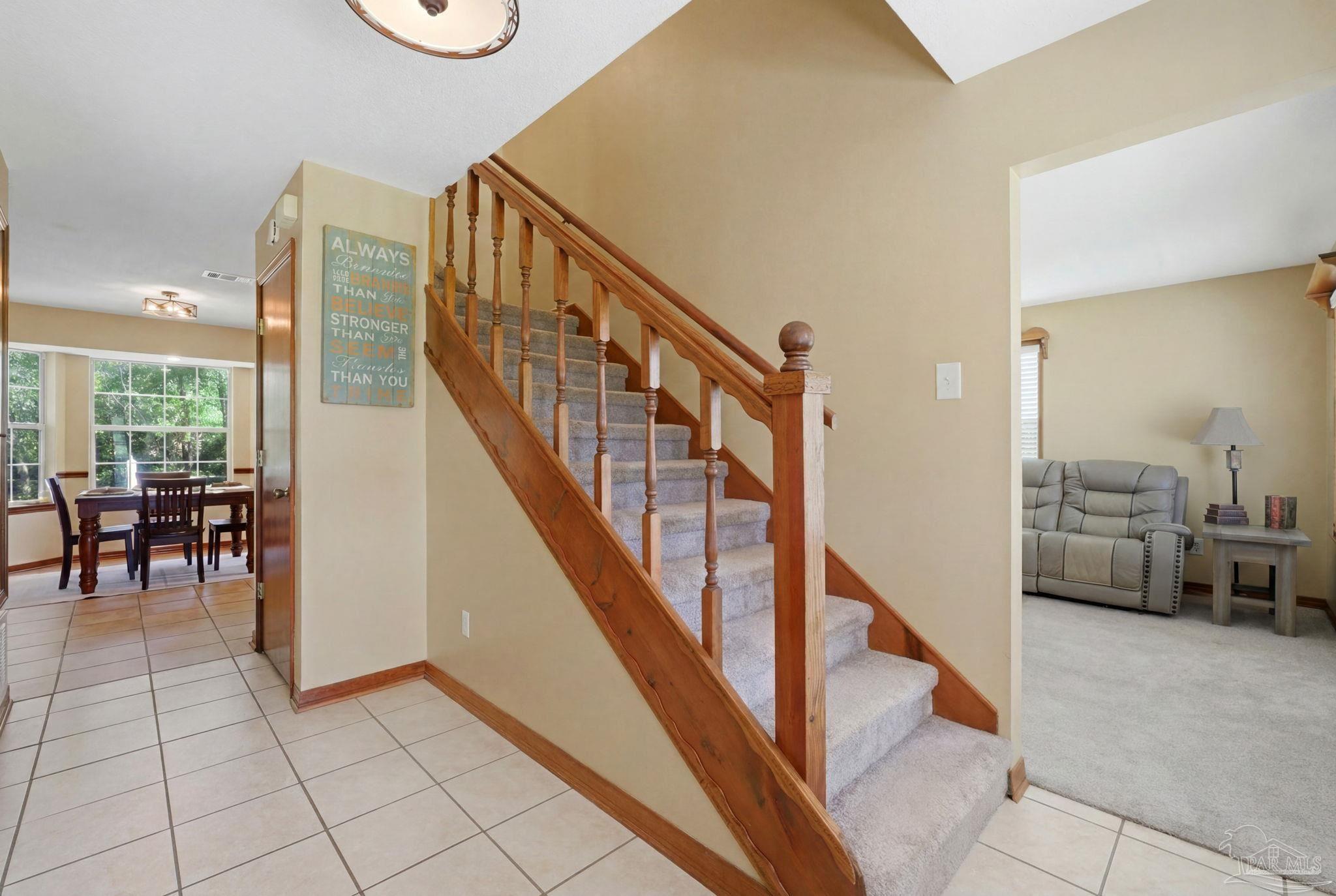 6870 Martin Road Milton, FL 32570 - Photo 20 of 48 a view of a livingroom with furniture and stairs