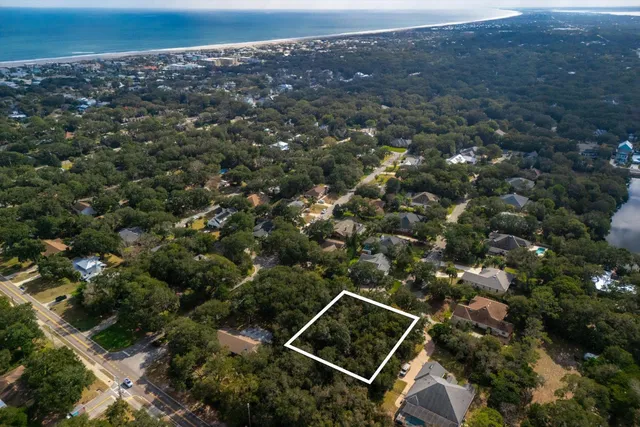 an aerial view of house with yard