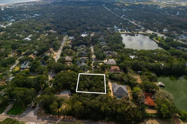 an aerial view of residential building with outdoor space and lake view