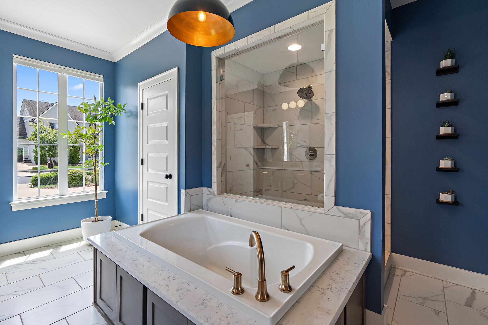 315 Colt Avenue Mount Juliet, TN 37122 - Photo 12 of 28 a bathroom with a tub a sink and a large mirror