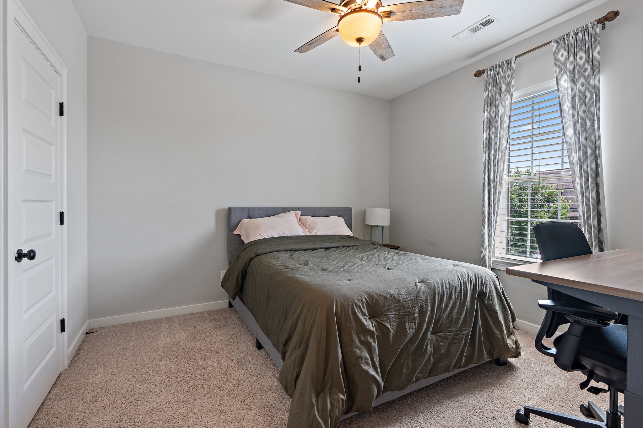 315 Colt Avenue Mount Juliet, TN 37122 - Photo 15 of 28 a bedroom with a bed and a table