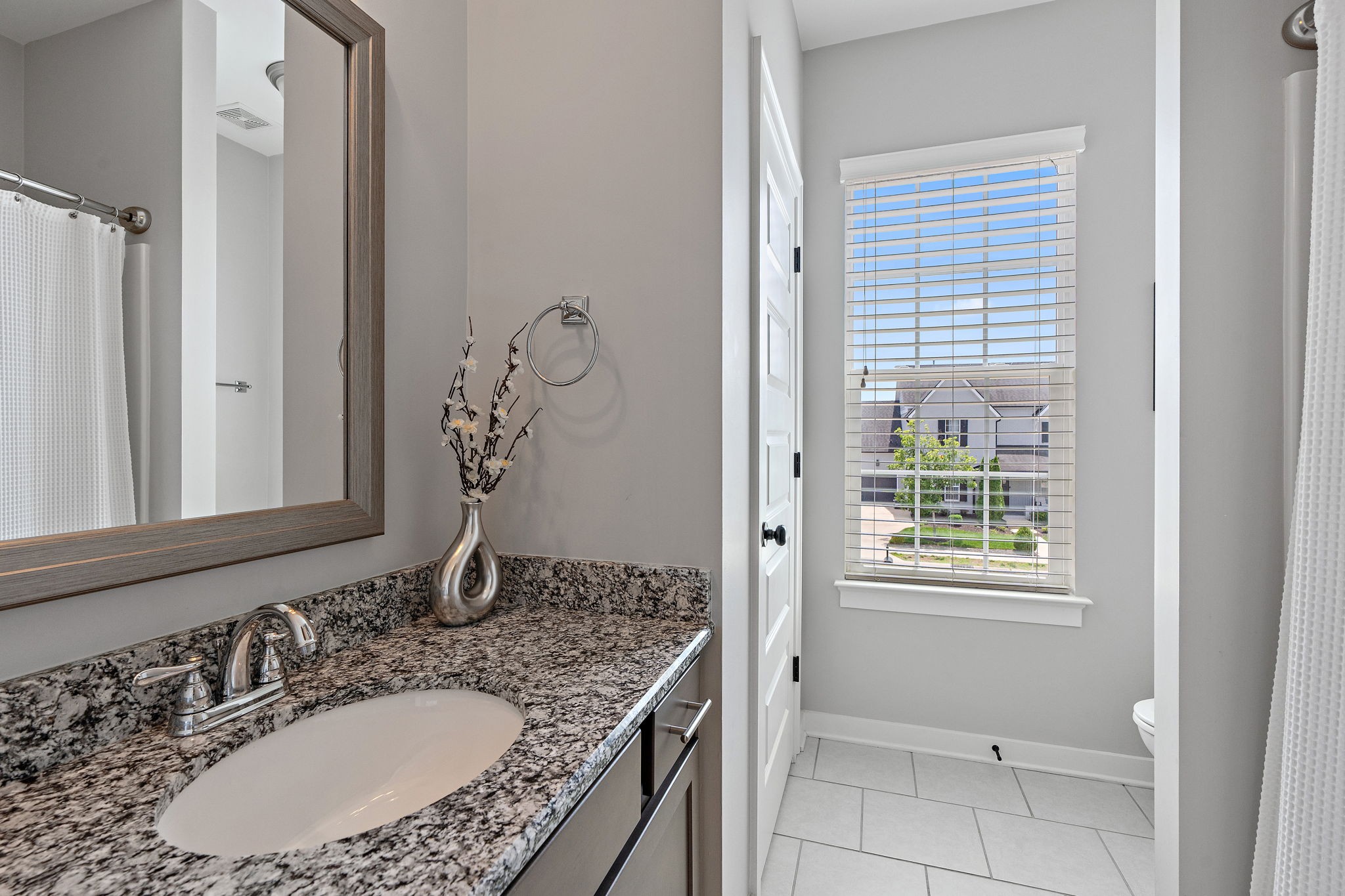 315 Colt Avenue Mount Juliet, TN 37122 - Photo 16 of 28 a bathroom with a granite countertop sink and a mirror