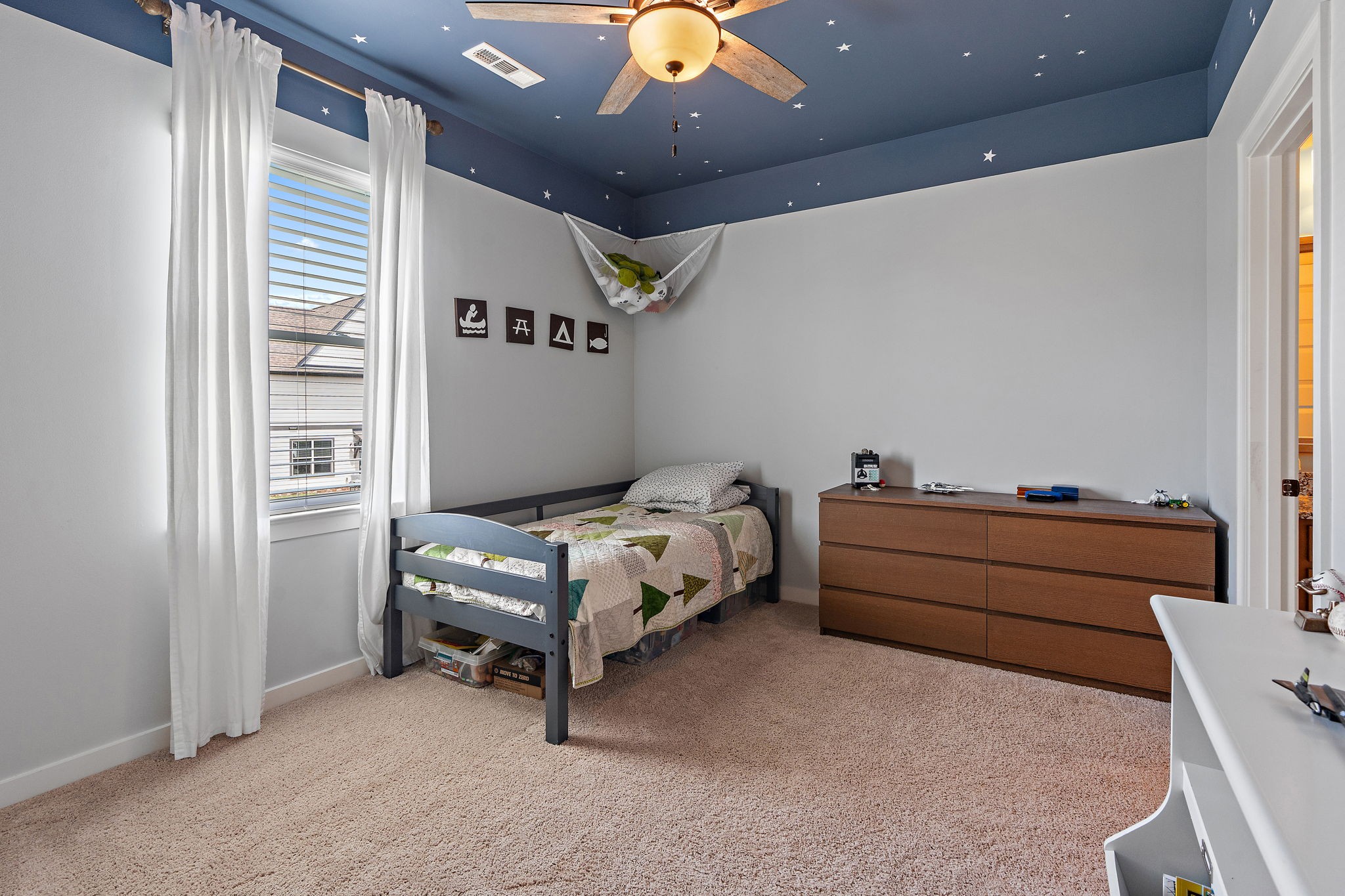 315 Colt Avenue Mount Juliet, TN 37122 - Photo 17 of 28 a bedroom with a bed and a chandelier