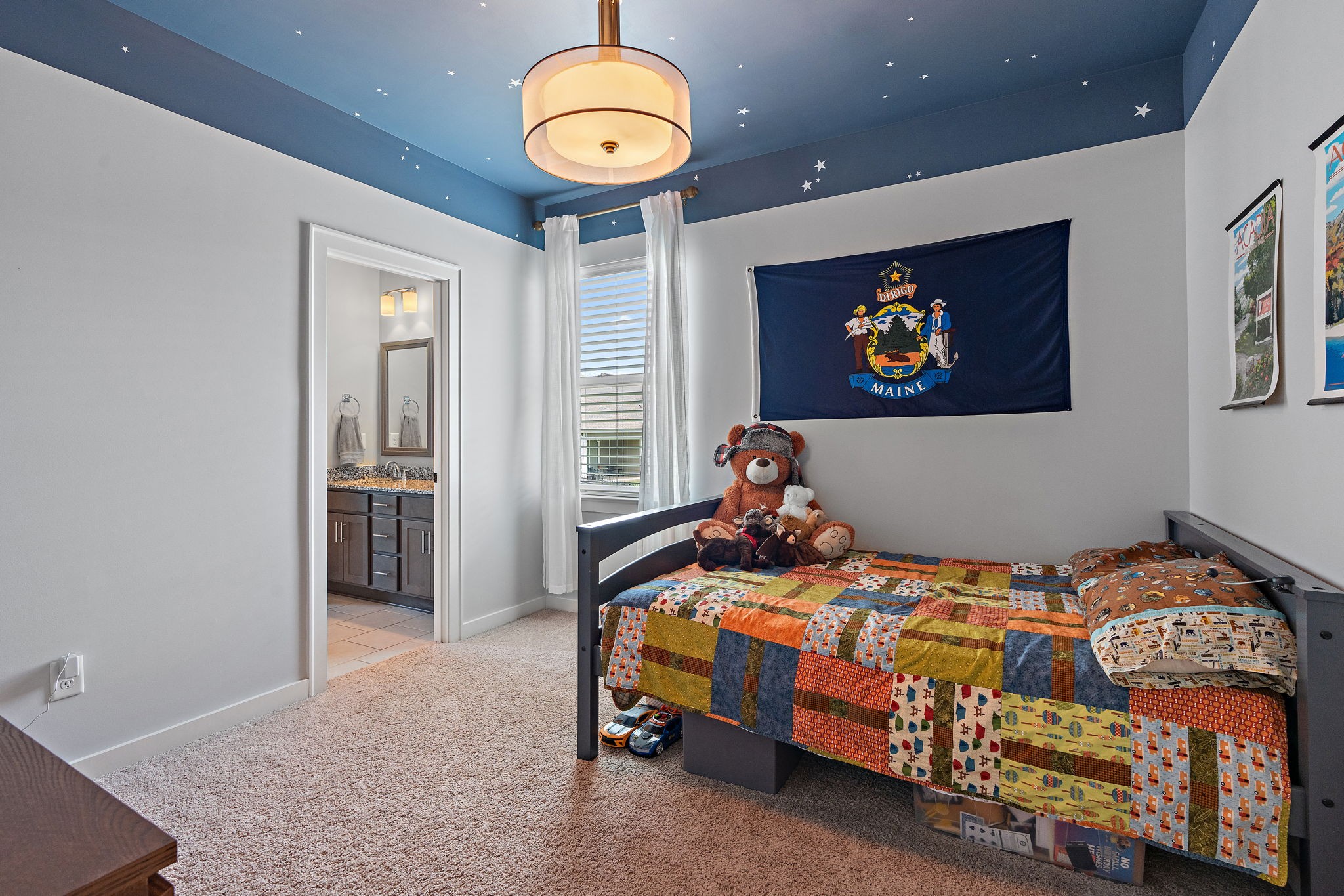 315 Colt Avenue Mount Juliet, TN 37122 - Photo 19 of 28 a bedroom with a bed and a chandelier