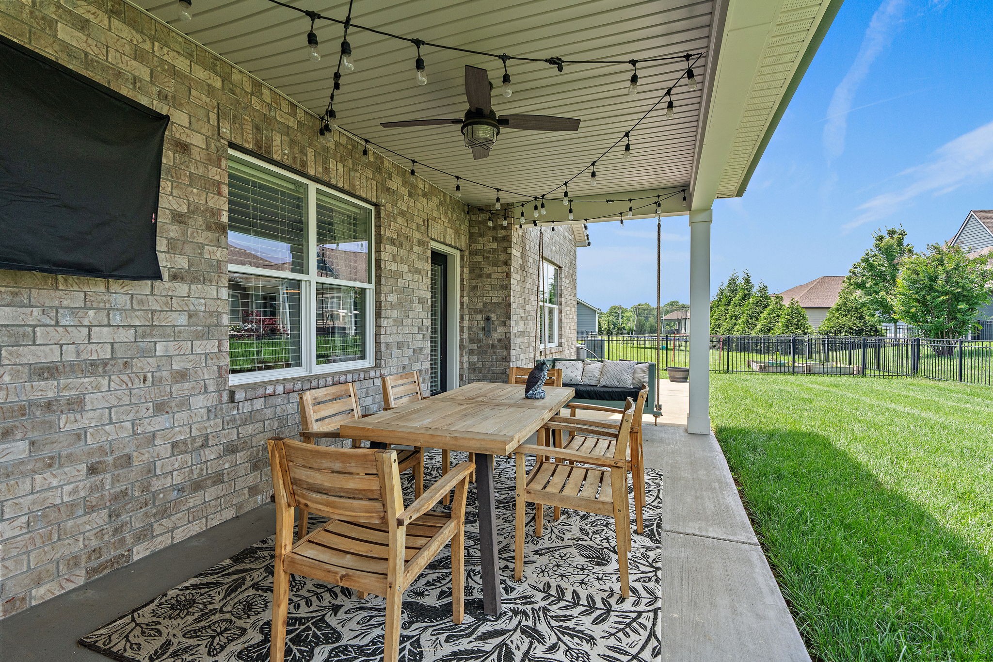 315 Colt Avenue Mount Juliet, TN 37122 - Photo 20 of 28 a patio with a table and chairs and potted plants