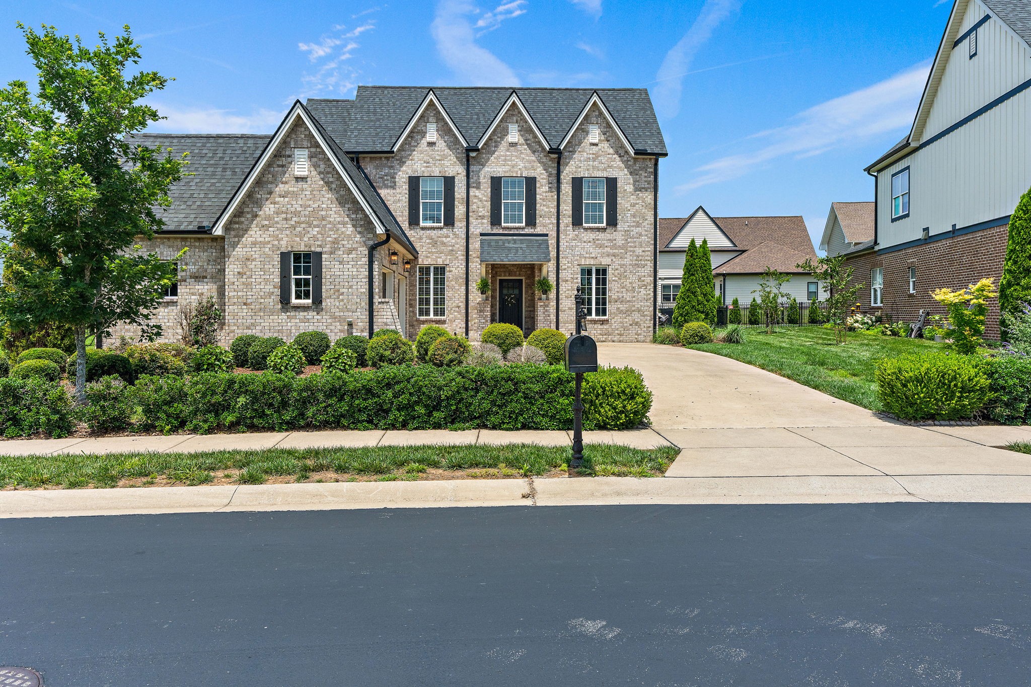 315 Colt Avenue Mount Juliet, TN 37122 - Photo 2 of 28 a front view of a house with a yard and garage