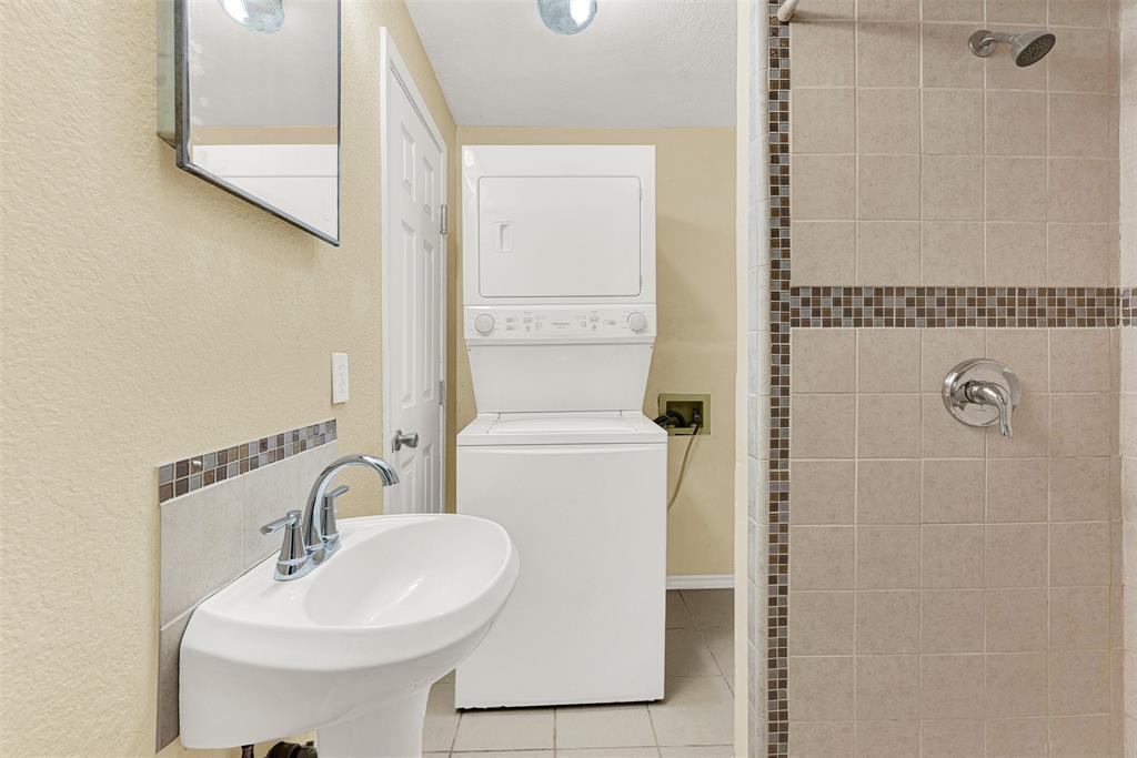 2418 Centerville Road Dallas, TX 75228 - Photo 15 of 22 Bathroom off Bedroom with laundry and shower