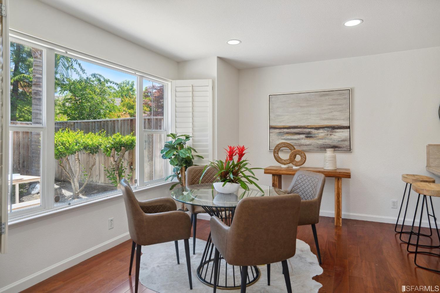 7531 Imperata Lane San Ramon, CA 94582 - Photo 11 of 37 a dining room with furniture potted plants and wooden floor