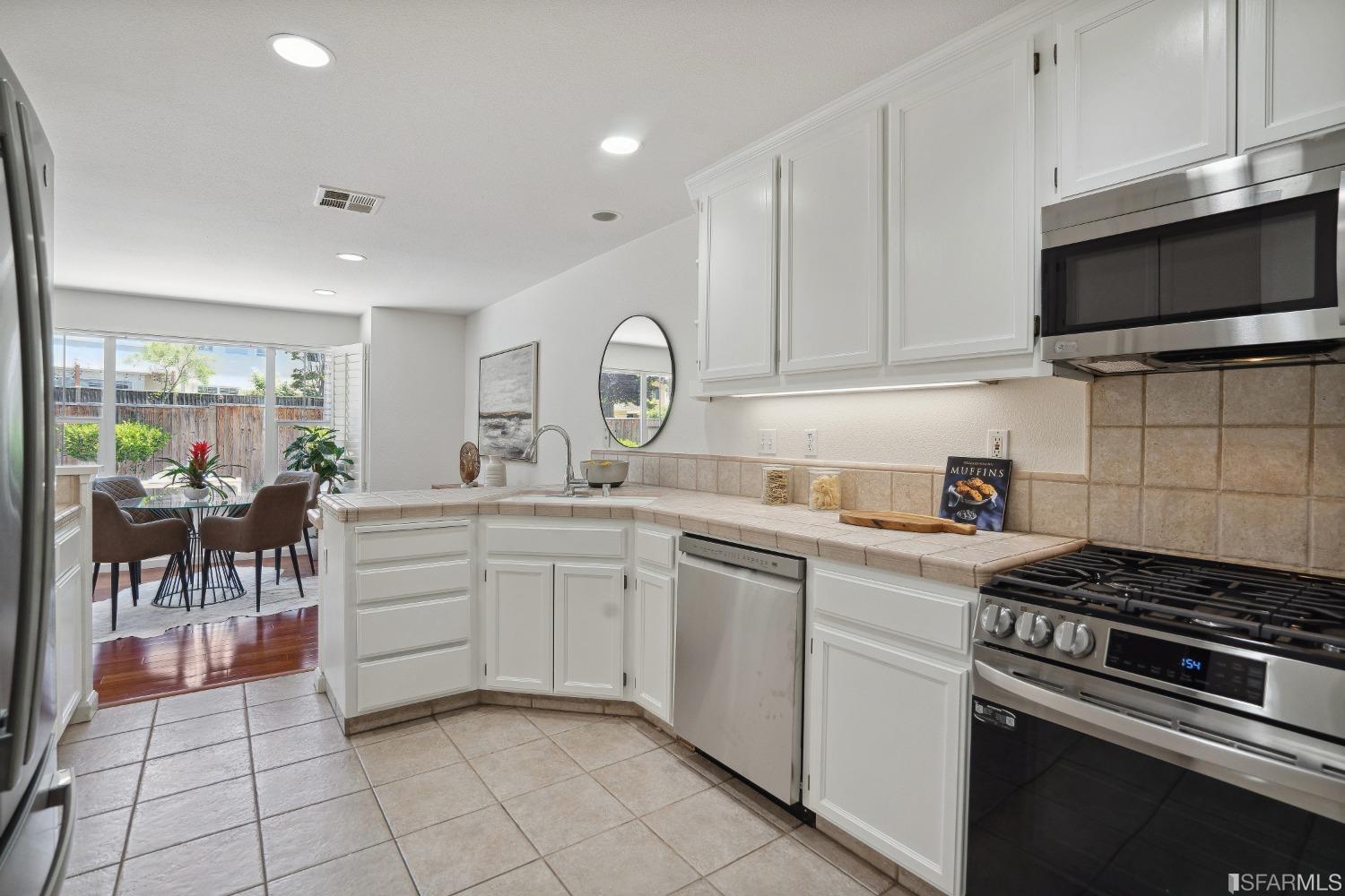 7531 Imperata Lane San Ramon, CA 94582 - Photo 16 of 37 a kitchen with appliances a sink and cabinets