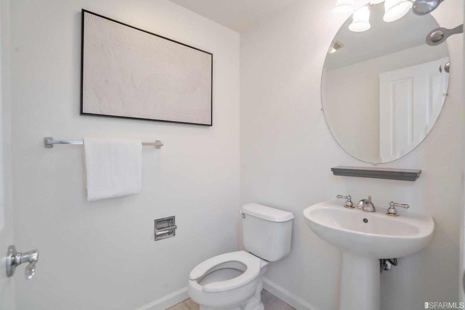 7531 Imperata Lane San Ramon, CA 94582 - Photo 19 of 37 a bathroom with a toilet sink and mirror