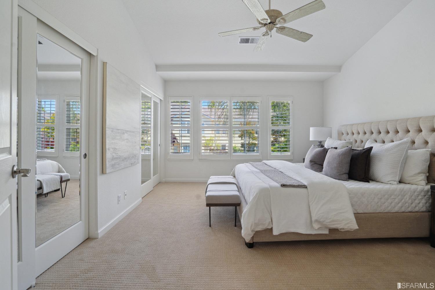 7531 Imperata Lane San Ramon, CA 94582 - Photo 20 of 37 a bedroom with a bed and glass walk in closet