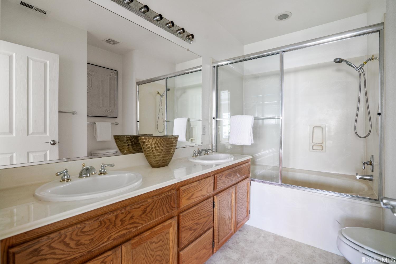 7531 Imperata Lane San Ramon, CA 94582 - Photo 22 of 37 a spacious bathroom with a granite countertop sink mirror and a bath tub